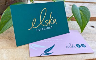 closeup image of a business card with gold lettering