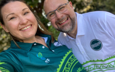 an image of two happy team members in uniform